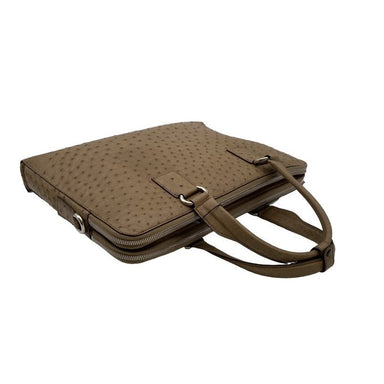 Genuine sustainably farmed African ostrich leather laptop bag laid flat in a taupe colour