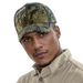 A man wearing a camoflague cap
