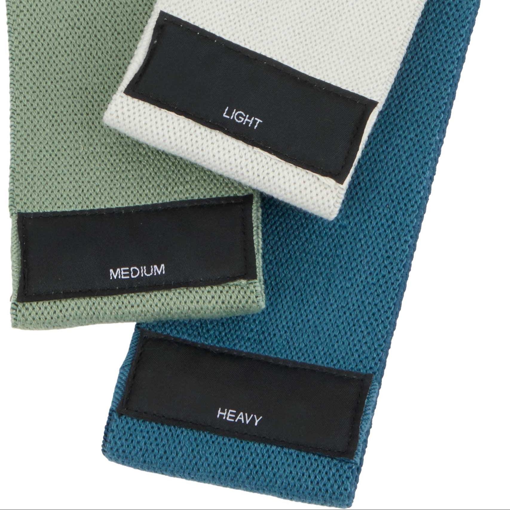 Three resistance bands of different intensity labeled 'Light', 'Medium', and 'Heavy' on a white background.